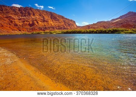 Lee's Ferry is a historic boat ferry. Steep river banks of red sandstone. Smooth turn of the Colorado River. Amazing wildlife. USA. The concept of active, extreme and photo tourism