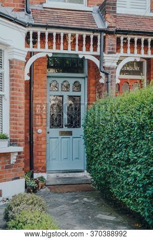 London, Uk - May 26, 2020: Blue Stained Glass Front Door Of An Edwardian House In London, Selective 