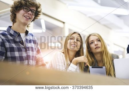 Young It Programmers Collaborating On Creating Application Using Digital Computers