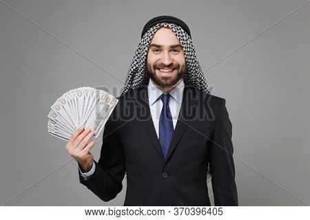 Smiling Bearded Arabian Muslim Businessman In Keffiyeh Kafiya Ring Igal Agal Suit Isolated On Gray B