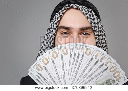 Close Up Of Young Arabian Muslim Businessman In Keffiyeh Kafiya Ring Igal Agal Isolated On Gray Back