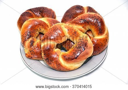 Bublik Recipe . Russian National Cuisine . Bagel With Poppy Seeds Isolated On White Plate Background