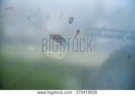 Childs Hand Print On A Steamy Window