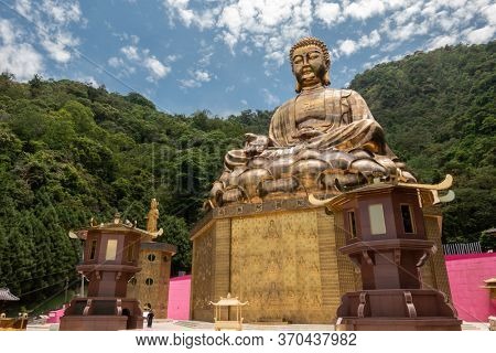 Puli, Taiwan - May 3th, 2020: big golden buddhist sculpture at Chengte Foshan, Puli township, Nantou, Taiwan
