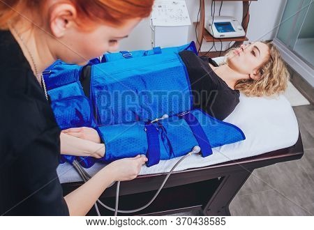 Pressotherapy Machine On Woman In Beauty Center