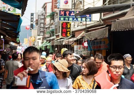 Nantou, Taiwan - September first, 2019: people walk at the marketplace street at Sun Moon Lake Swimming Carnival, Nantou, Taiwan