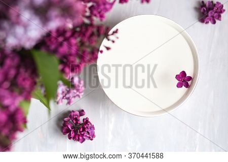 Five-pointed Lilac Flower Among Lilac Flowers In A Cup With Water. Spa Ritual. Lilac Branch With A F