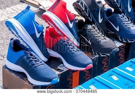 China, Heihe, July 2019: Sale Of Sports Shoes On The Street In Heihe City In The Summer