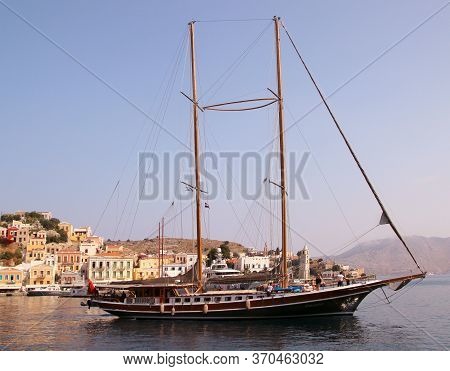 Symi, Greece - June 05, 2020: Symi Town, Symi Island, Pictorial View Of Colorful Houses And The Harb