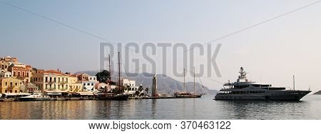 Symi, Greece - June 05, 2020: Symi Town, Symi Island, Pictorial View Of Colorful Houses And The Harb
