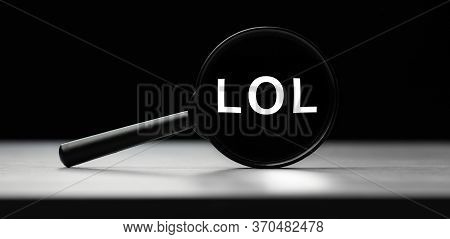 Magnifying Glass With Text Lol On Wooden Table. Concept Of Search