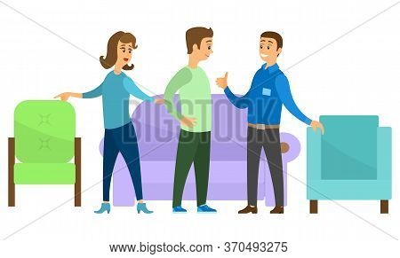 People Stand Near Furniture Indoor. Woman Points To Green Chair. Lilac Colored Sofa With Soft Fabric