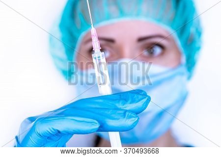 Doctor Or Profesional Holding Syringe And Needle. Syringe, Medical Injection In Hand, Vaccination Eq