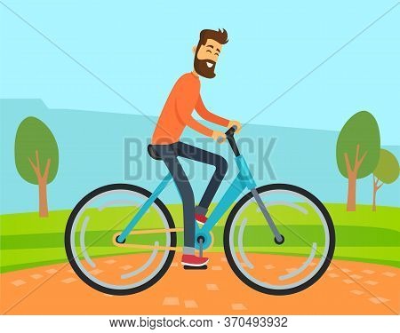 Man Riding Bicycle In Park Or Countryside In Summer. Guy Spend Time Actively Doing His Hobby. Grass 