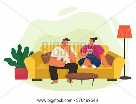 Life Of Young Couple Sitting On Sofa And Eating Popcorn. Domestic Leisure Of Wife And Husband At Hom