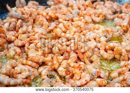 Seafood Street Food. King Prawns Fried Outdoors In A Large Frying Pan. Festival.