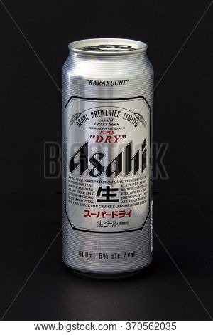 Calgary, Alberta, Canada. June 08, 2020. An Isolated Stella Asahi Tallboy Beer Can On A Black Backgr