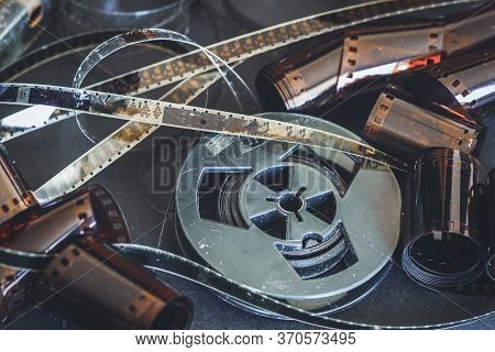 Old Scratched 8 Mm And 16mm Film Strips, Bobbin, Retro Film And Photo. Vintage Background