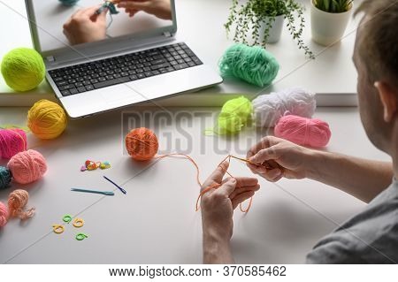 Selective Focus On The Hands Of A Man Sitting At The Table And Watching A Video Step By Step Guide O