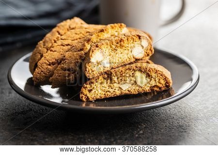 Sweet italian cantuccini cookies. Almonds biscuits on plate.