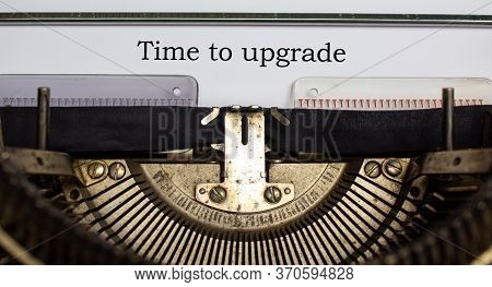 Text 'time To Upgraid' Typed On Retro Typewriter. Business Concept.