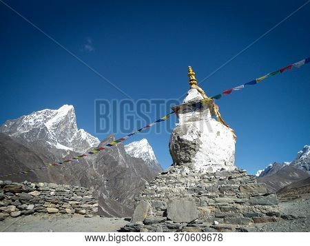 White Stupa, Prayers Flags And Amazing Landscape In The Everest Base Camp Trek In Nepal