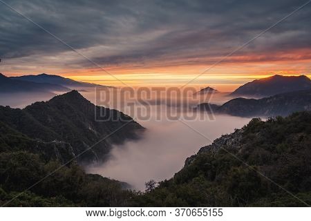 A Sea Of Clouds Turn Golden And Colorful During Sunset At Sequoia And Kings Canyon National Parks