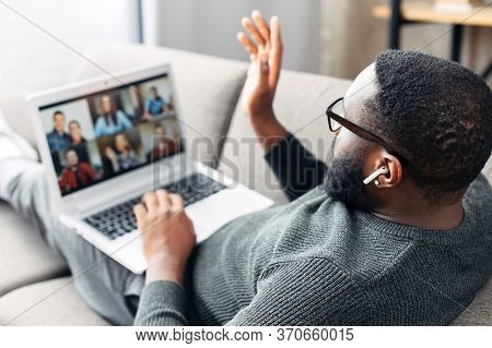 African-american Young Guy Is Using App On Laptop For Video Meeting With Many People Together. Black