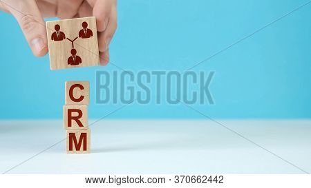 Concept Text Crm, Customer Relationship Management On Cubes On A Beautiful Blue Background. Business