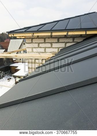 Close Up View Of Scaffolding And House Under Construction With Grey Folding Roof On Waterproofing La