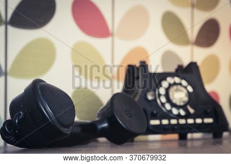Old Retro And Vintage Rotary Phone Off The Hook, Colorful Wallpaper, Selective Focus