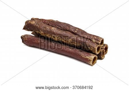Beef Dried Treats For Pets On A White Background. Five Dried Sticks Of The Esophagus. Treats To Pets