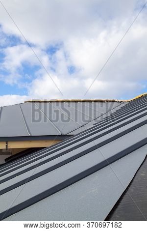 Close-up View Of Seam Roof Under Construction On Waterproofing Layer