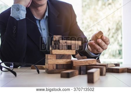 Business Collapse Concept. Stressed Businessman Failure To Build A Tower Block.
