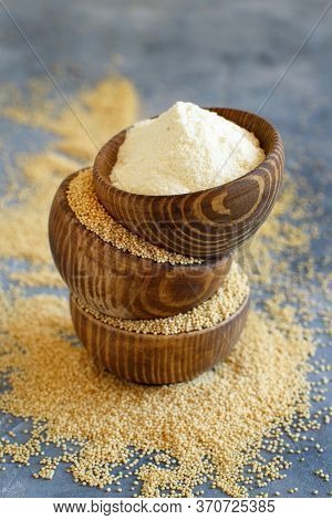 Wooden Bowls Of Raw Amaranth Flour And Seeds Close Up