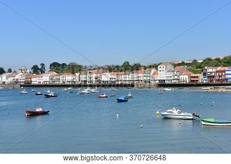 Mugardos, Spain. May 30, 2020. Fishing Village With Wooden Boardwalk, Colorful Houses And Boats With