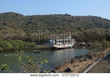 MUMBAI, INDIA - FEBRUARY 15, 2020: Abandoned tourist boat on Elefanta Island near Mumbai, India