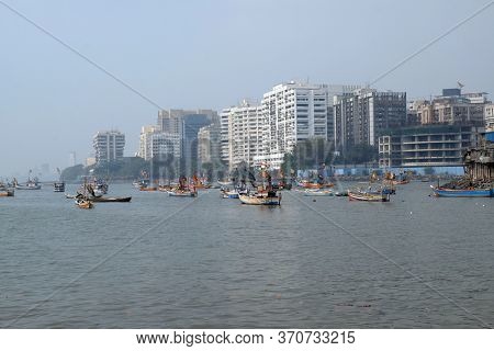 MUMBAI, INDIA - FEBRUARY 13, 2020: Fishing boats at Colaba fishing village, southern end of Mumbai city, India