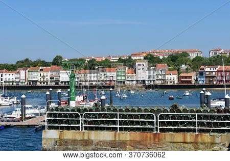 Mugardos, Spain. May 30, 2020. Fishing Village And Harbour With Colorful Houses And Boats With Blue 