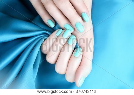 Female Hand With Manicured Nails Mint Color