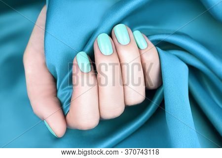 Female Hand With Manicured Nails Mint Color