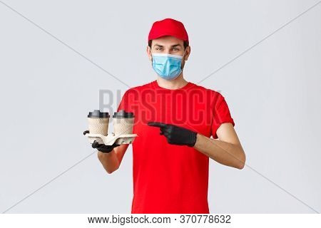 Takeaway, Food And Groceries Delivery, Covid-19 Contactless Orders Concept. Cheerful Courier In Red 