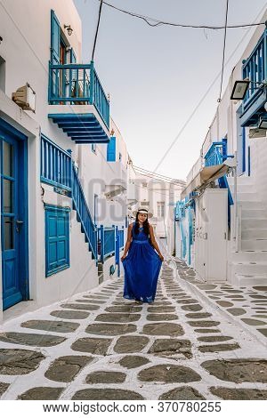 Mykonos Greece, Woman On Vacation At The Greek Island Mykonos, Girl In Dress At The White Streets Of