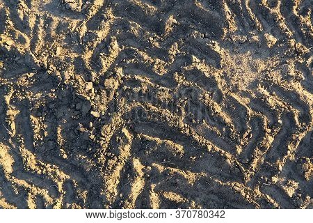 Excavator Tracks On The Ground Texture. Mud Ground Earth Soil Trace Tracks Marks Markings Dry Surfac