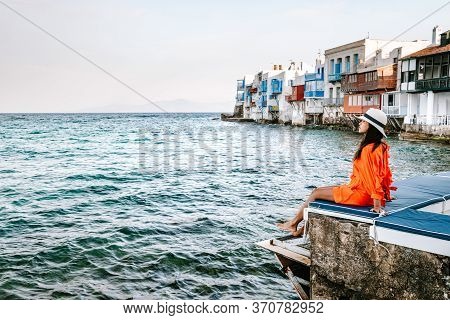 Mykonos Greece, Woman On Vacation At The Greek Island Mykonos, Girl In Dress At The White Streets Of