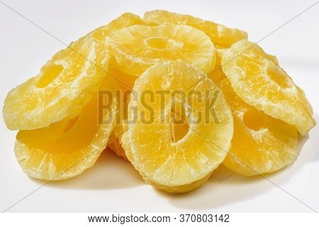 Yellow Pineapple Candies, Sliced In Round Slices In Powdered Sugar, On A White Background.