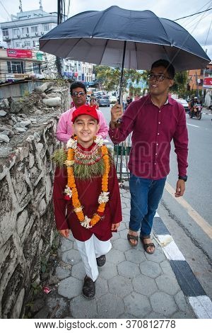 Kathmandu,nepal - June July 6,2019: Hindu Boy Returning Home From Temple With His Maternal Uncle Dur