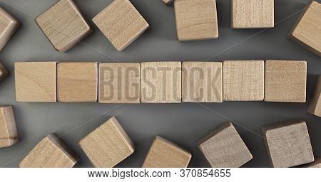 A Pile Of Empty Wood Block On Table. Top View. Business Concept For Growth Success Process. Copy Spa