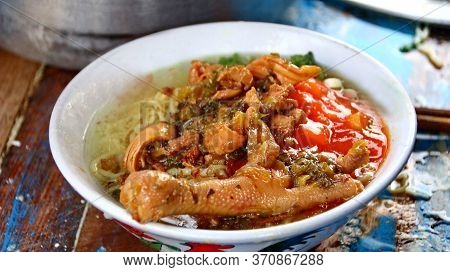 Indonesian Food, Mie Ayam, Noodles With Chicken Presented Directly By The Seller On The Cart, Unfocu