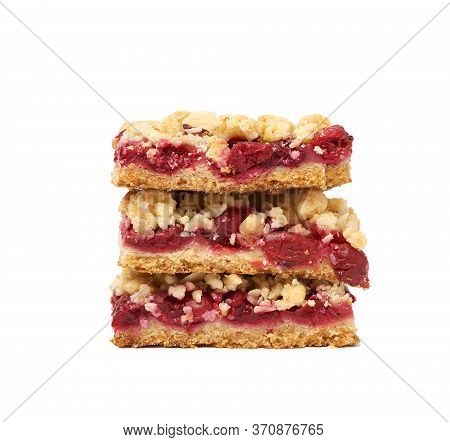 Stack Of Square Baked Slices Of Cramble With Red Cherry Isolated On A White Background, Delicious Pi